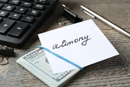 calculator and money set aside for alimony
