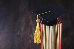 Graduation Cap sitting on a book