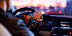 person driving at sunset